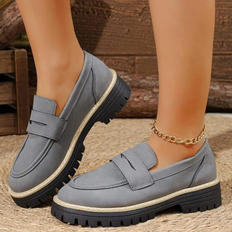 Fashionable lady's loafersleather low-top thick heel one-piece casual shoes.